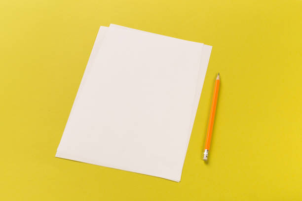 istock Pencils with sharpening shavings with white paper sheets on coloured backgroung, Office tool 1084099964