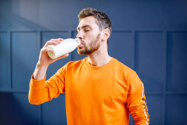 istock Sports man drinking milk 1084100446