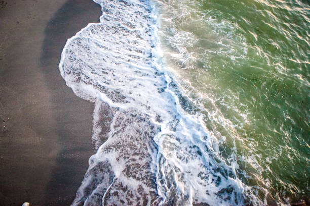 istock Aerial View of Waves and Surf 1084102828