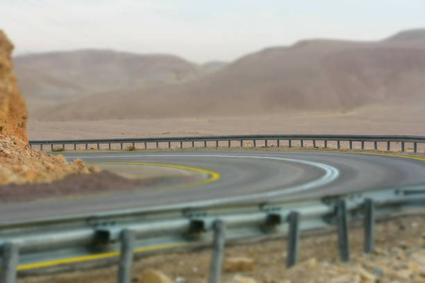 istock A winding road with safety railing 1084103142