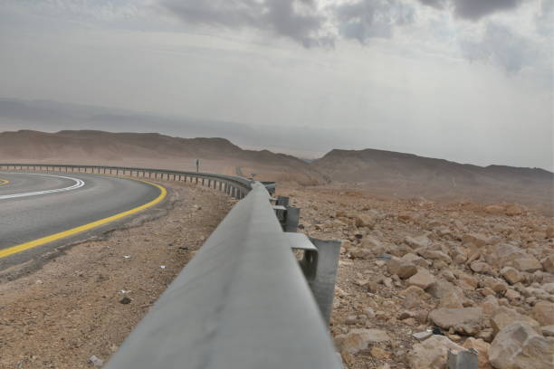 istock A winding road with safety railing 1084105332