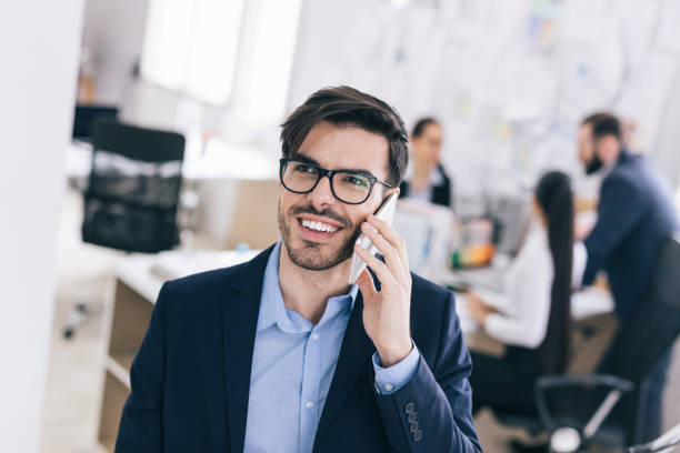 istock Young businessman making call on smart phone 1084105632