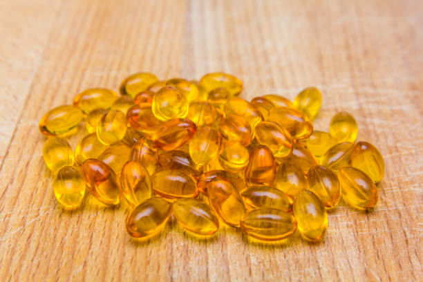 Fish oil capsules Fish oil capsules full of omega 3 eicosapentaenoic acid stock pictures, royalty-free photos & images
