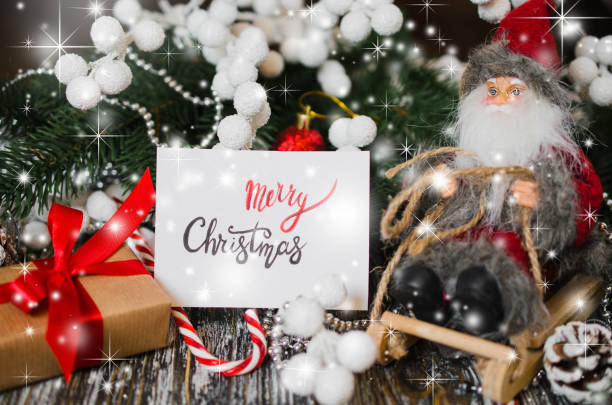 istock Christmas still life with decorative Santa and gift box. 1084109760