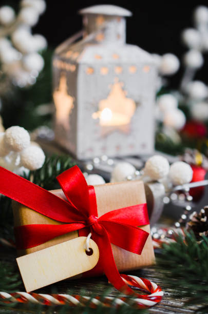 istock Christmas still life with gift box and empty tag. 1084109792