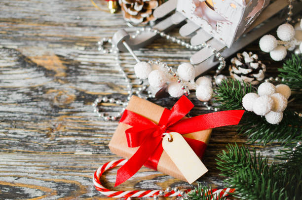 istock Christmas still life with gift box and empty tag. 1084109806