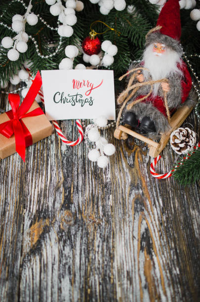 istock Christmas still life with decorative Santa and gift box. 1084109840