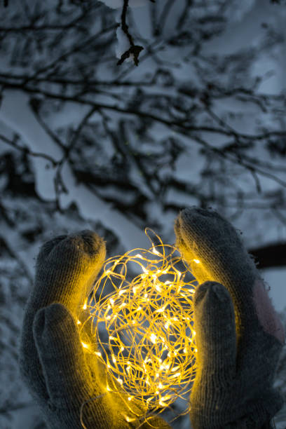 istock The festoon lights in hands outdoor. 1084111206