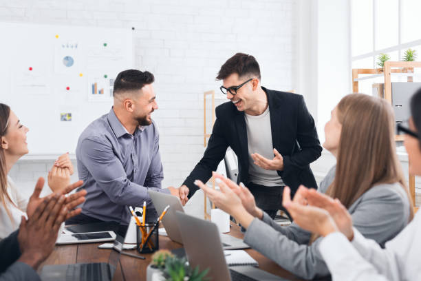 istock Businessmen shaking hands after meeting in office 1084111478