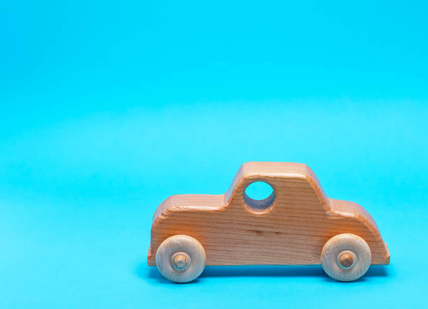 istock wooden childrens car on a blue background 1084112712