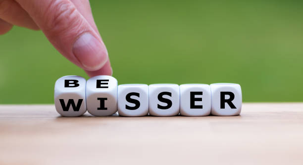 istock Hand is turning dices and changes the german word 