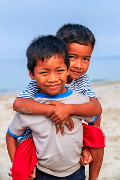istock Cambodian little boys playing on the beach, Cambodia 1084116708