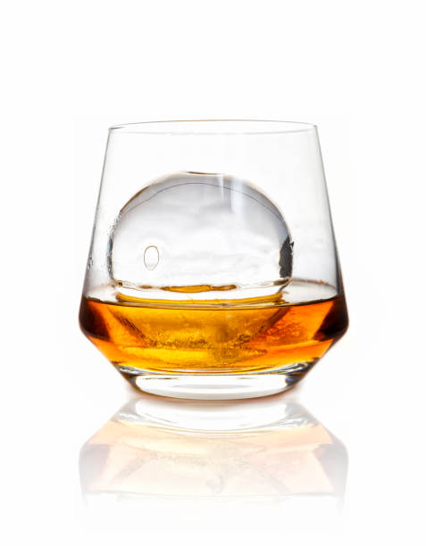 glass of whiskey with ice stock photo