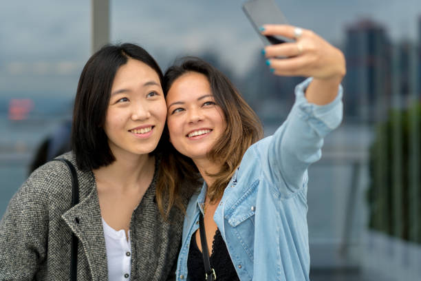 istock Two young friends taking a selfie together 1084123004