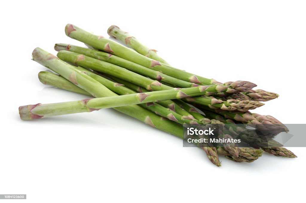 Green asparagus sticks Green asparagus sticks isolated on white background. Studio shot. Asparagus Stock Photo