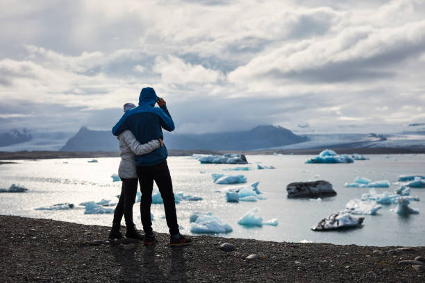 istock Happy couple enjoying glacier lagoon 1084126810