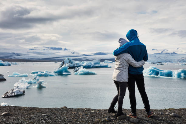 istock Happy couple enjoying glacier lagoon 1084126814