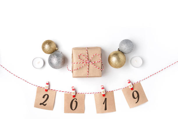 istock Golden and silver balls, gift, candles, notes with wish on cloth 1084128912