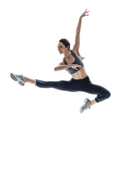 istock Beautiful athletic woman dancing in midair 1084129098
