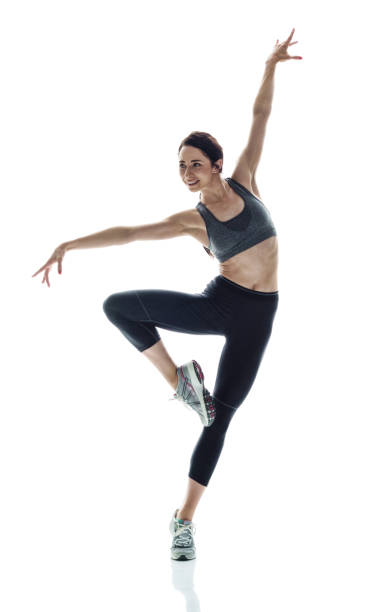 istock Beautiful athletic woman striking a graceful pose 1084129110