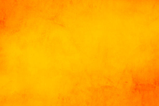 istock Horizontal yellow and orange grunge texture cement or concrete wall banner, blank  background 1084136632