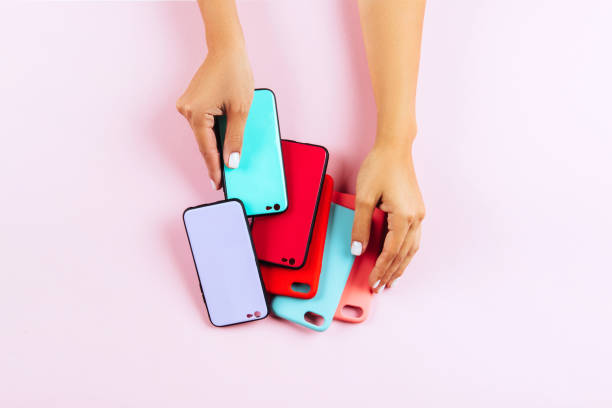 istock hands holding colorful smartphone cases 1084145644