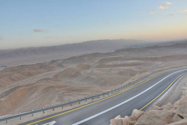 istock A winding road with safety railing 1084149240
