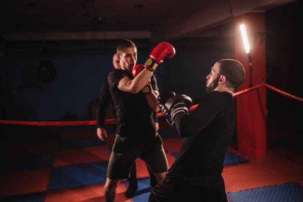 istock Kick boxers fighting in boxing ring 1084150368