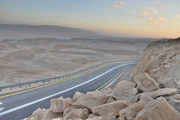 istock A winding road with safety railing 1084150412
