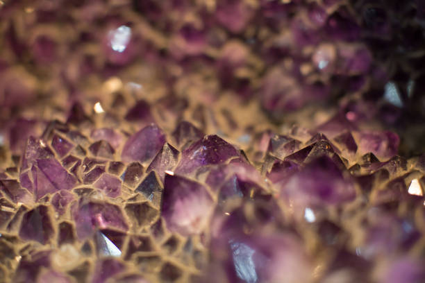 High magnification macro shot of purple amethyst crystals with yellow calcite crystals
