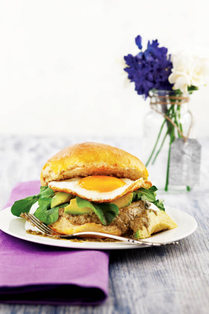 istock Vegetarian burger with  Avocado and roasted egg,Fresh vegetarian burger. 1084153830