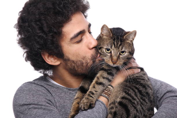 istock Beautiful afro man with a cat 1084154956