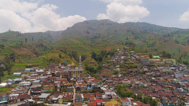 istock Mountain landscape farmlands and village Java Indonesia 1084158736