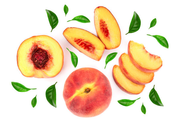 istock ripe peaches with leaves isolated on white background. Top view. Flat lay pattern 1084159184