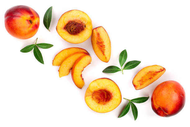 istock ripe nectarine with leaves isolated on white background with copy space for your text. Top view. Flat lay pattern 1084159242