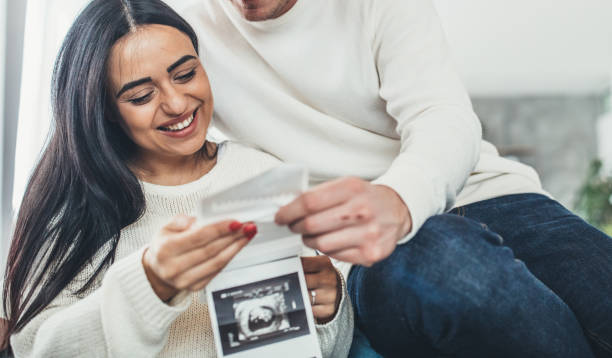 istock Couple with baby ultrasound 1084162004
