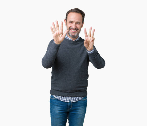 istock Handsome middle age senior man wearing a sweater over isolated background showing and pointing up with fingers number eight while smiling confident and happy. 1084162356