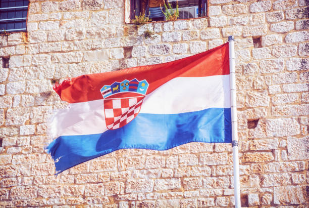 istock Croatian flag on stone background 1084164194