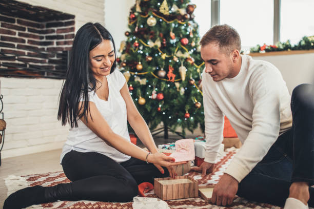 istock Husband giving gift to his wife 1084164270