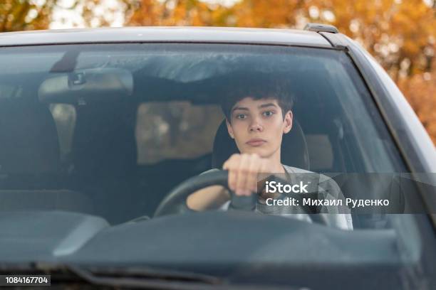 Young Teenager Learns How To Drive The Car F Stock Photo - Download Image Now - Driving, Teenager, Child