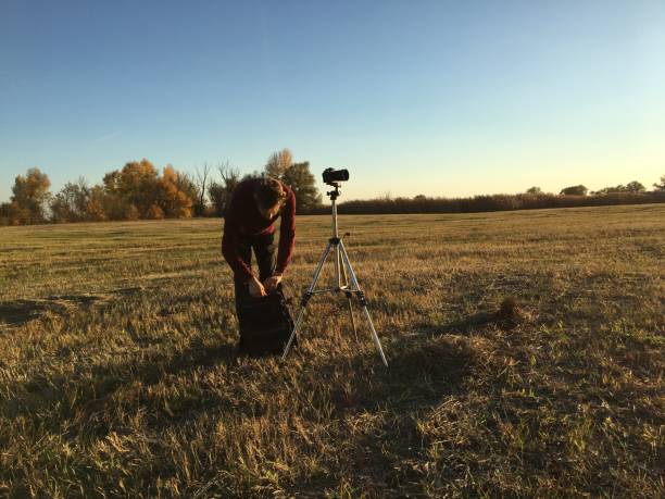 istock photographer using tripod and make landscape photography f 1084168510