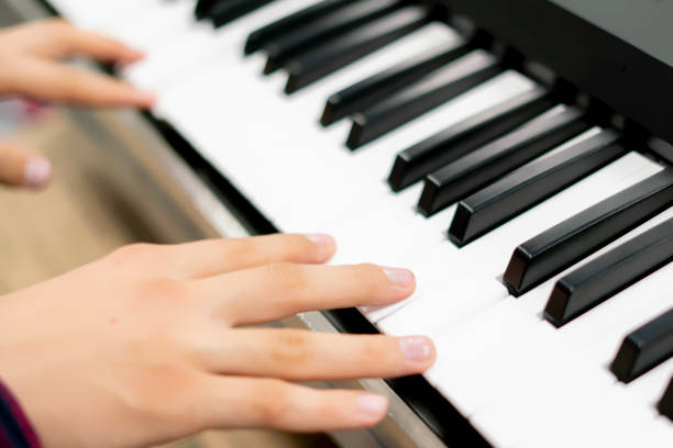 istock close up hands playing different chords on piano keys f 1084168676