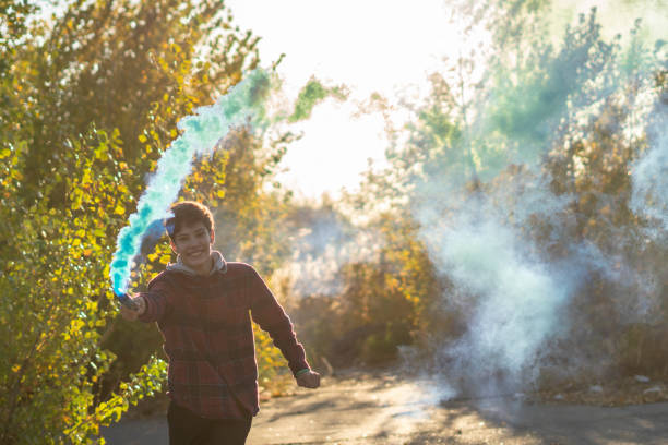 istock young man have fun with smoke fire cracker f 1084170716