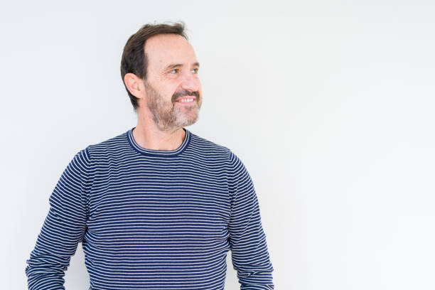 istock Handsome senior man over isolated background smiling looking side and staring away thinking. 1084171226