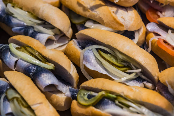 Sandwich with fish at the fair close-up shot.