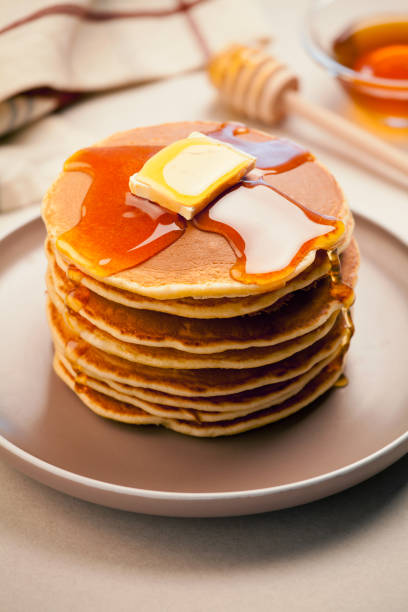 istock Stack Of Homemade Pancakes With Honey 1084176680