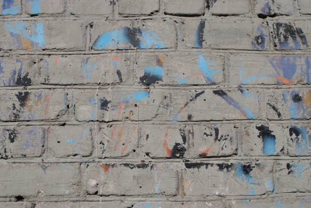 istock The brick texture with cracks and scratches can be used as a background 1084181434