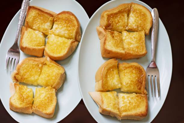 istock Grilled sweet buttered toast in plates. 1084187816