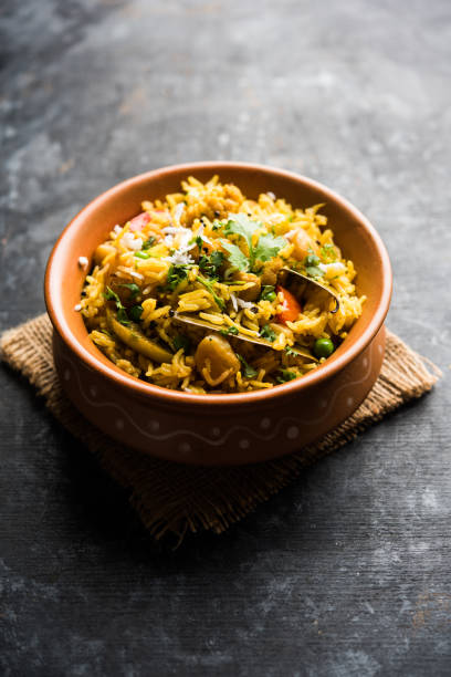 istock Masala Rice or masale bhat - is a spicy vegetable fried rice / biryani or Pulav usually made during wedding occassions in maharashtra, India 1084191388