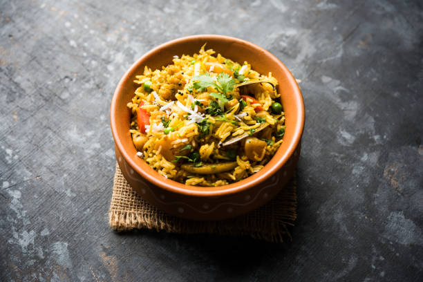 istock Masala Rice or masale bhat - is a spicy vegetable fried rice / biryani or Pulav usually made during wedding occassions in maharashtra, India 1084191468